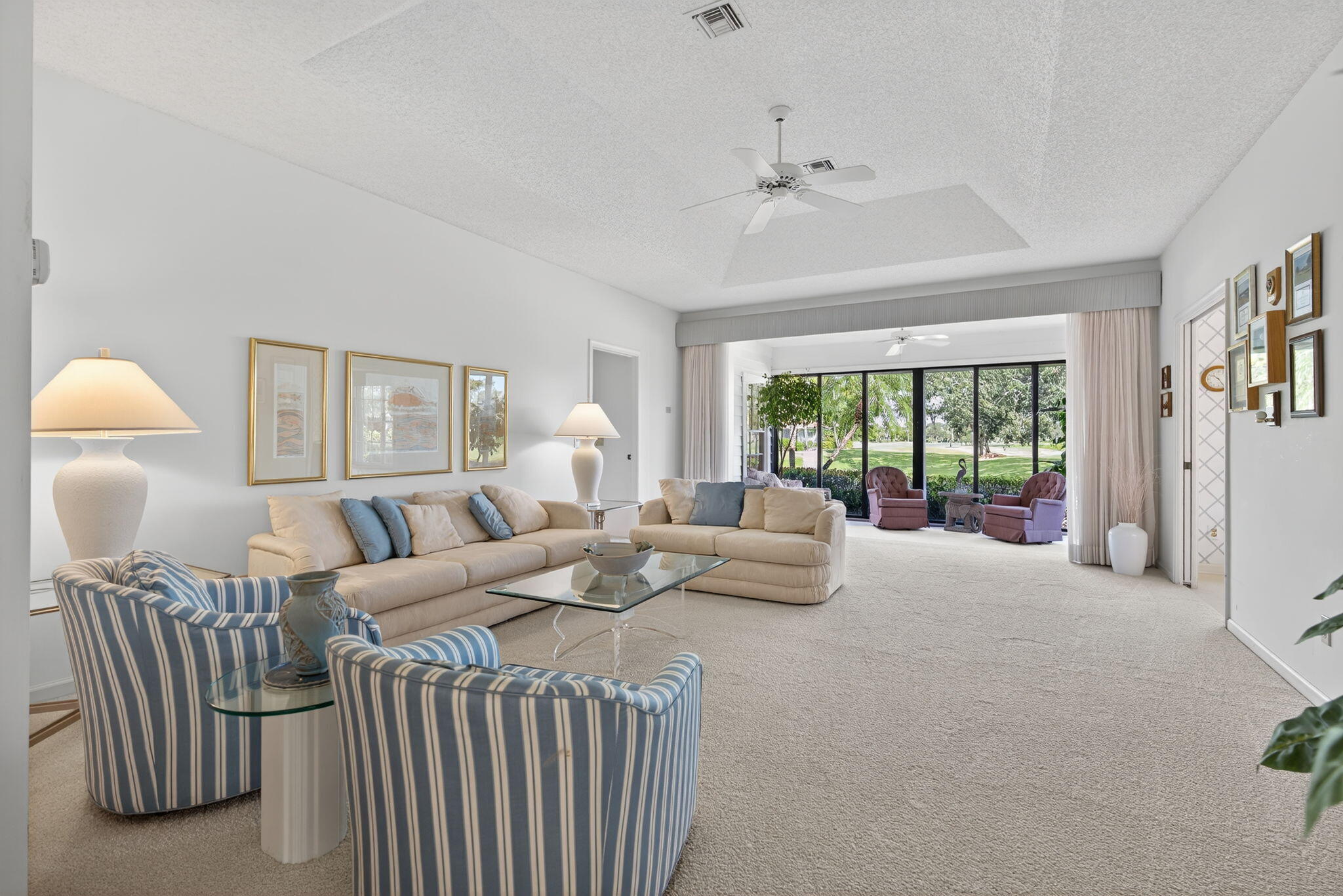 7036 Southeast Winged Foot Drive Stuart, FL 34997 - Photo 16 of 65 a bedroom with a large bed and a window