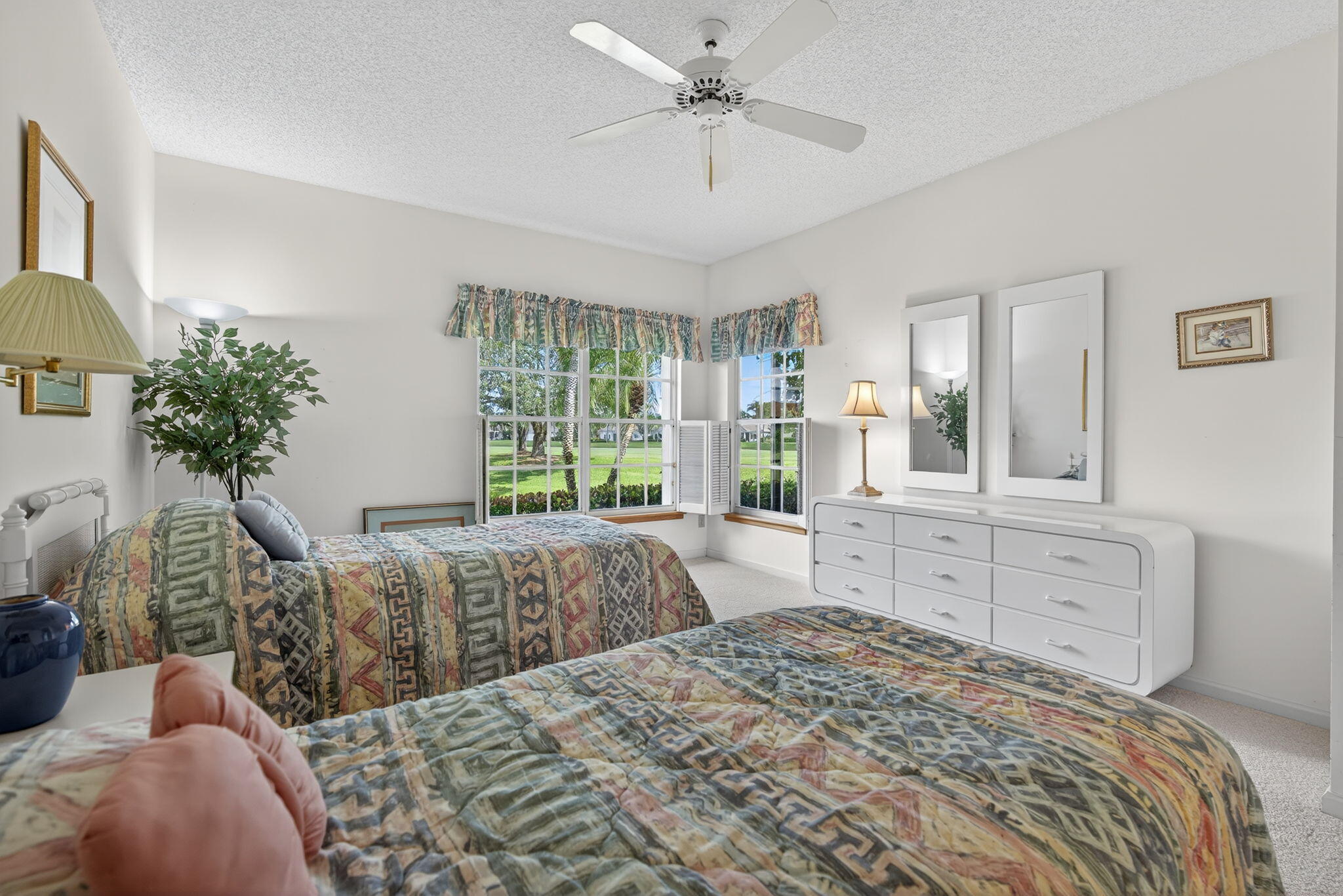 7036 Southeast Winged Foot Drive Stuart, FL 34997 - Photo 28 of 65 a bedroom with a large bed and a window