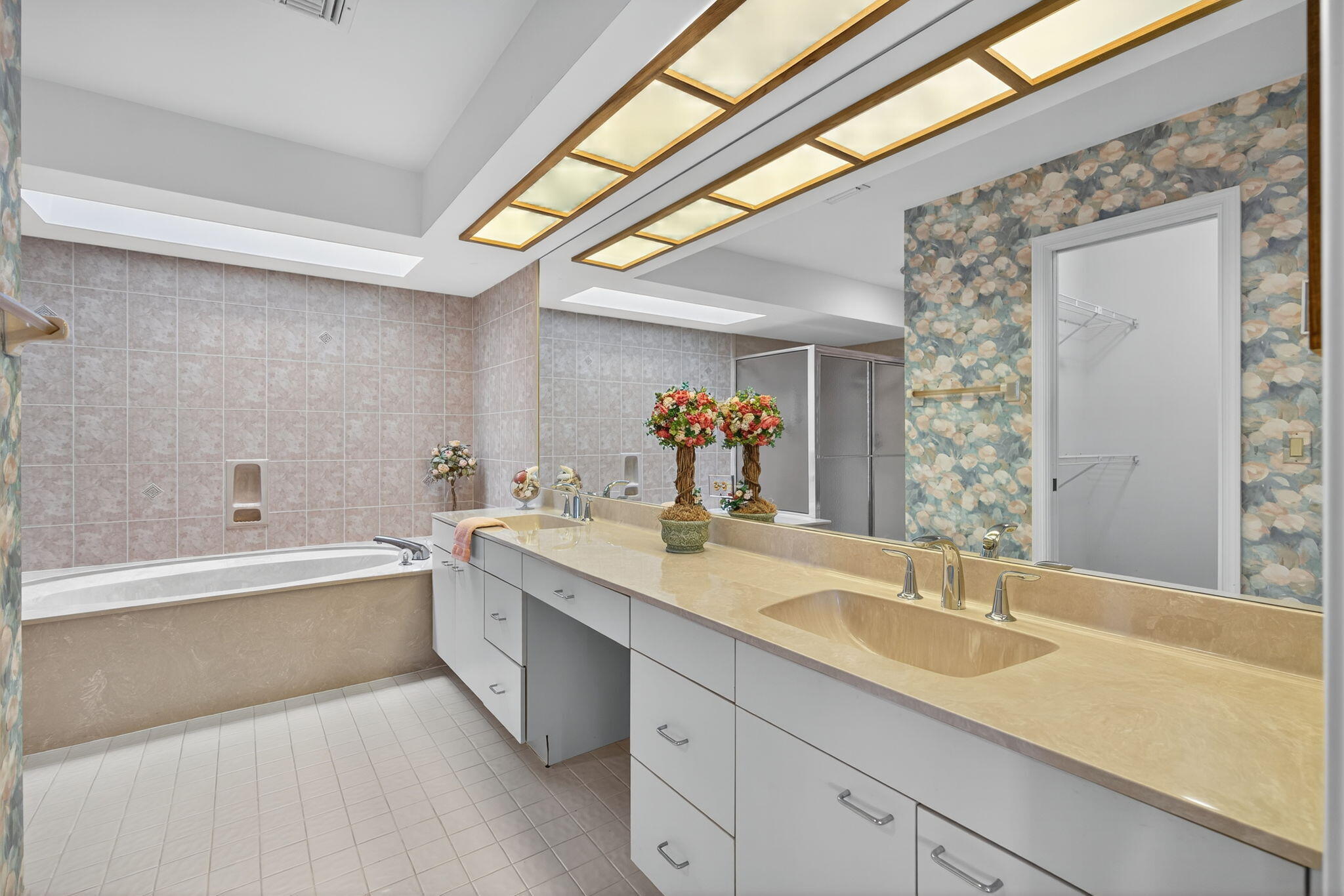 7036 Southeast Winged Foot Drive Stuart, FL 34997 - Photo 30 of 65 a bathroom with a granite countertop sink and a bathtub