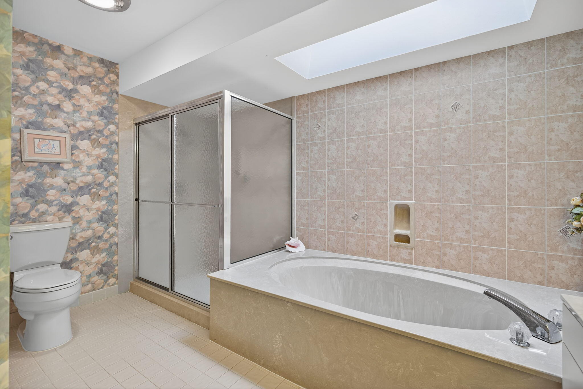 7036 Southeast Winged Foot Drive Stuart, FL 34997 - Photo 31 of 65 a bathroom with a bathtub and a toilet