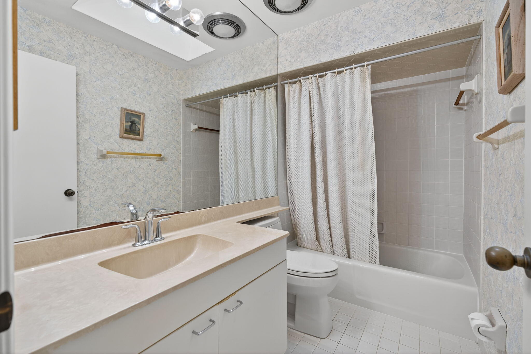 7036 Southeast Winged Foot Drive Stuart, FL 34997 - Photo 36 of 65 a bathroom with a sink a toilet and shower