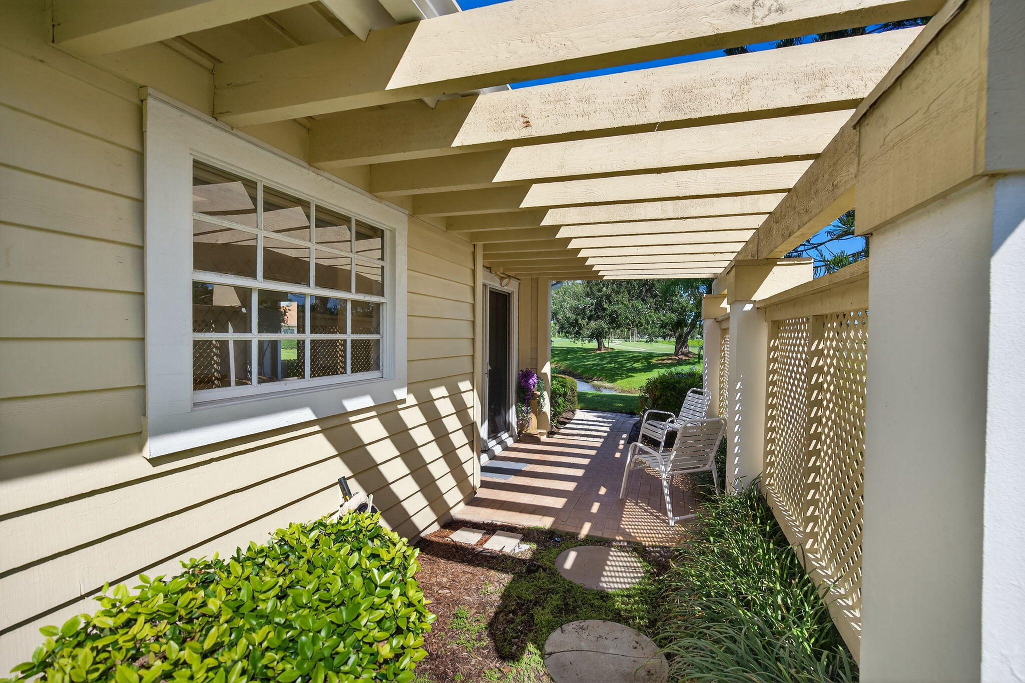 7036 Southeast Winged Foot Drive Stuart, FL 34997 - Photo 37 of 65 a view of a chair and tables in the balcony
