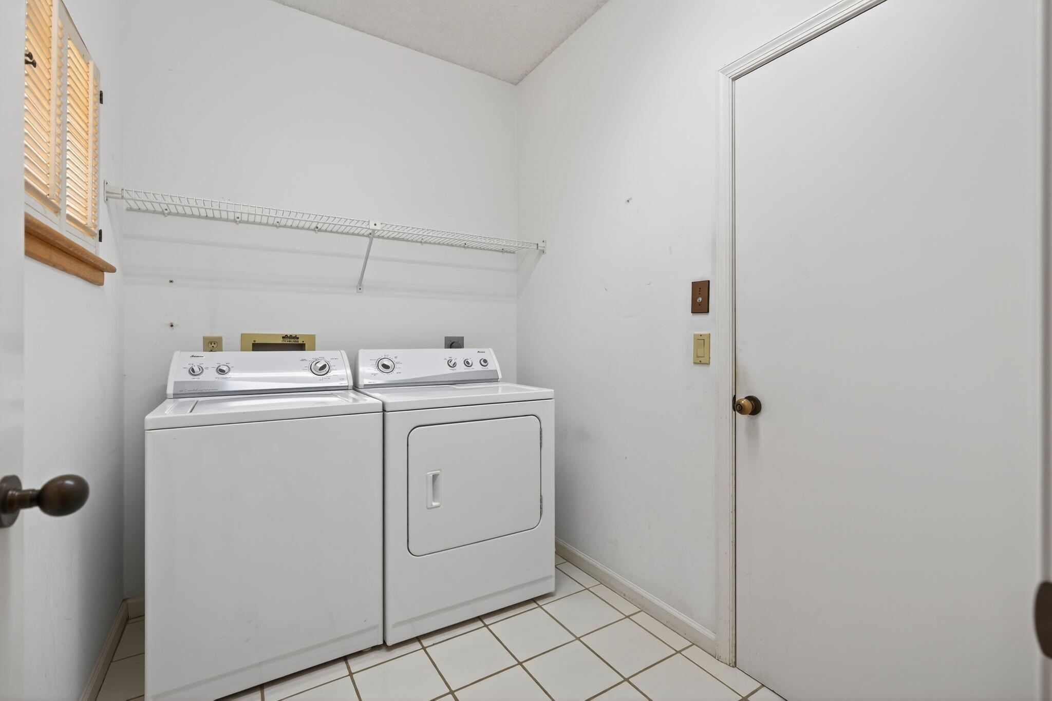 7036 Southeast Winged Foot Drive Stuart, FL 34997 - Photo 40 of 65 a utility room with dryer and washer
