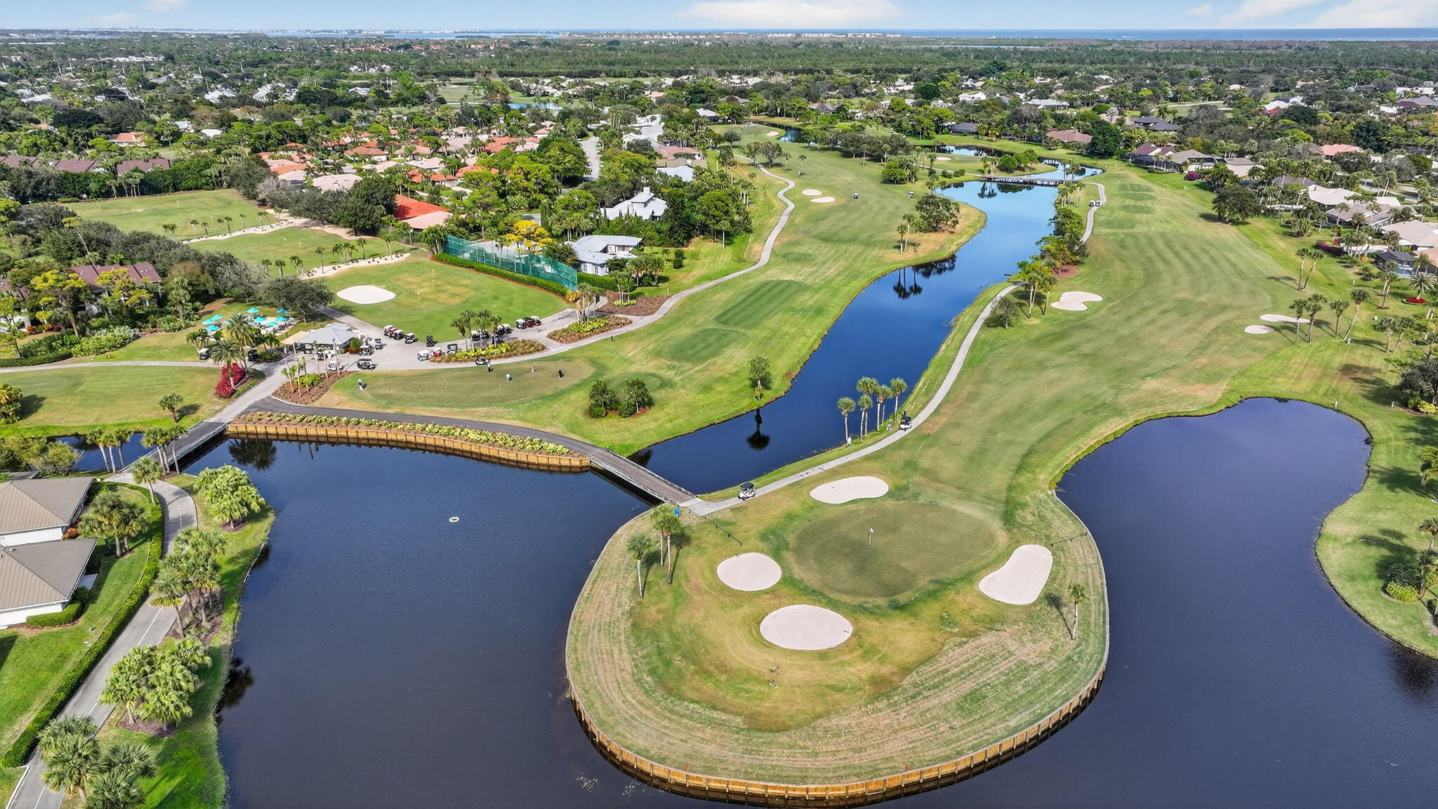 7036 Southeast Winged Foot Drive Stuart, FL 34997 - Photo 62 of 65 an aerial view of a house with a swimming pool yard and outdoor seating
