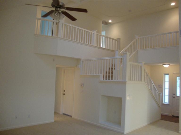 142 East Shoemake Avenue Reedley, CA 93654 - Photo 7 of 10 a view of staircase with white walls