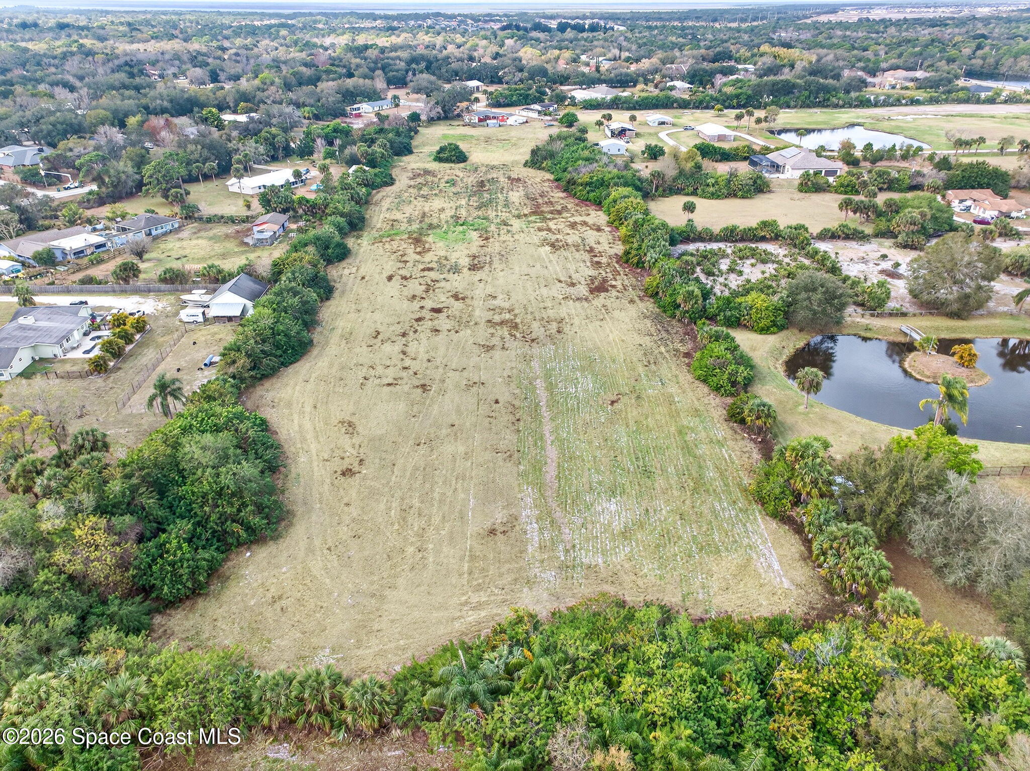 3825 Turtle Mound Road Melbourne, FL 32934 - Photo 17 of 19 an aerial view of residential houses with outdoor space