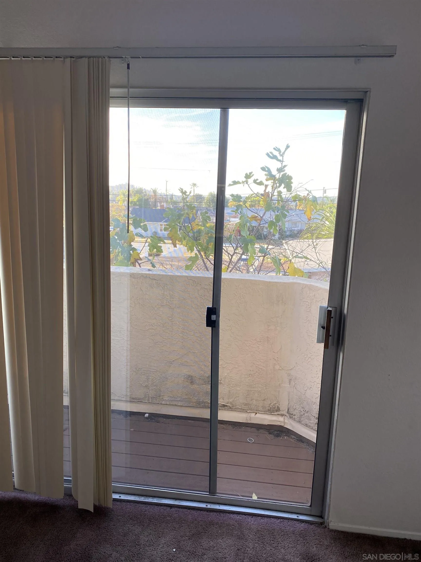 514 Jamacha Road, Unit 24J El Cajon, CA 92019 - Photo 18 of 32 a view of a glass door and a window