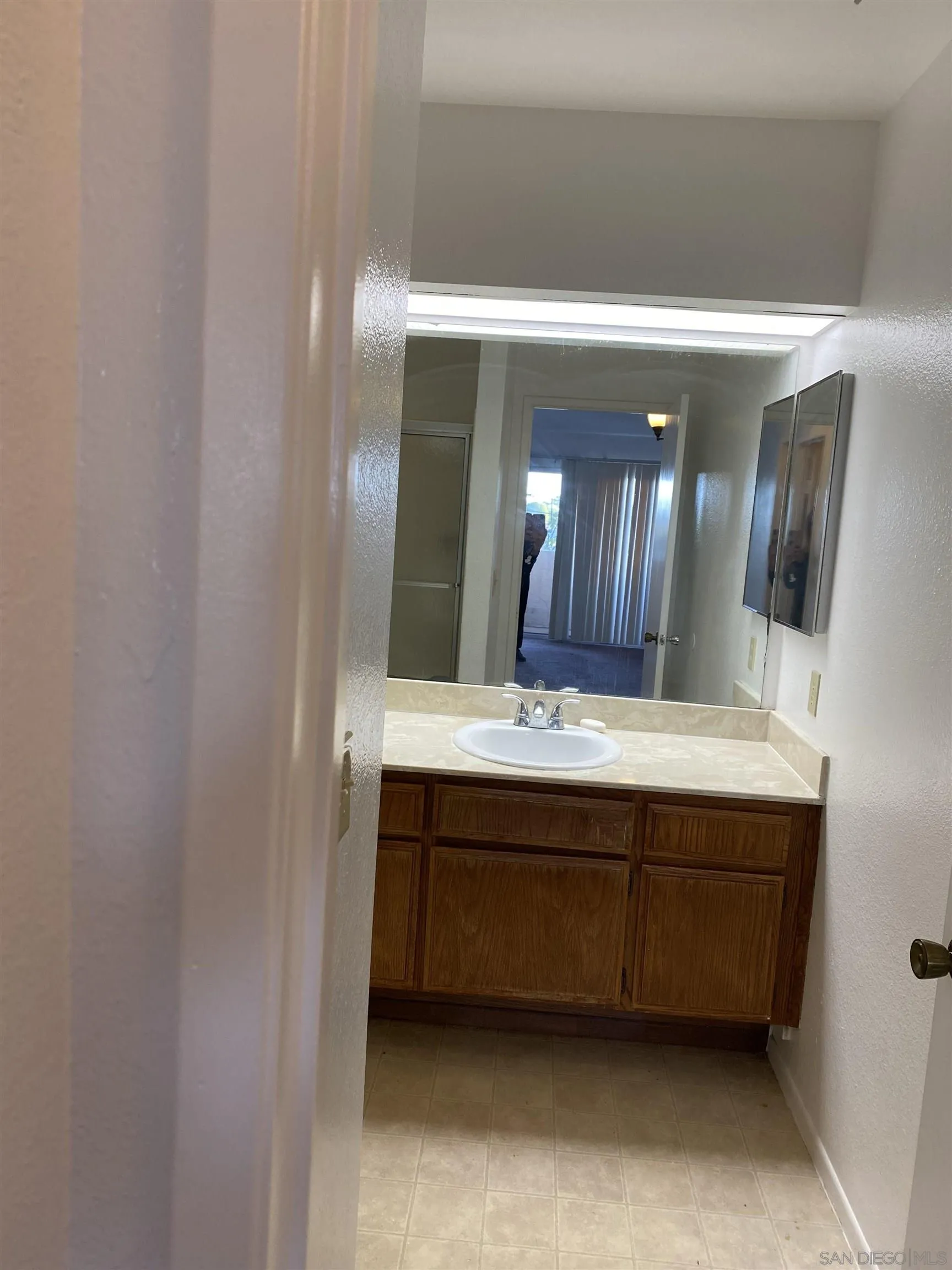 514 Jamacha Road, Unit 24J El Cajon, CA 92019 - Photo 20 of 32 a bathroom with a double vanity sink and a mirror