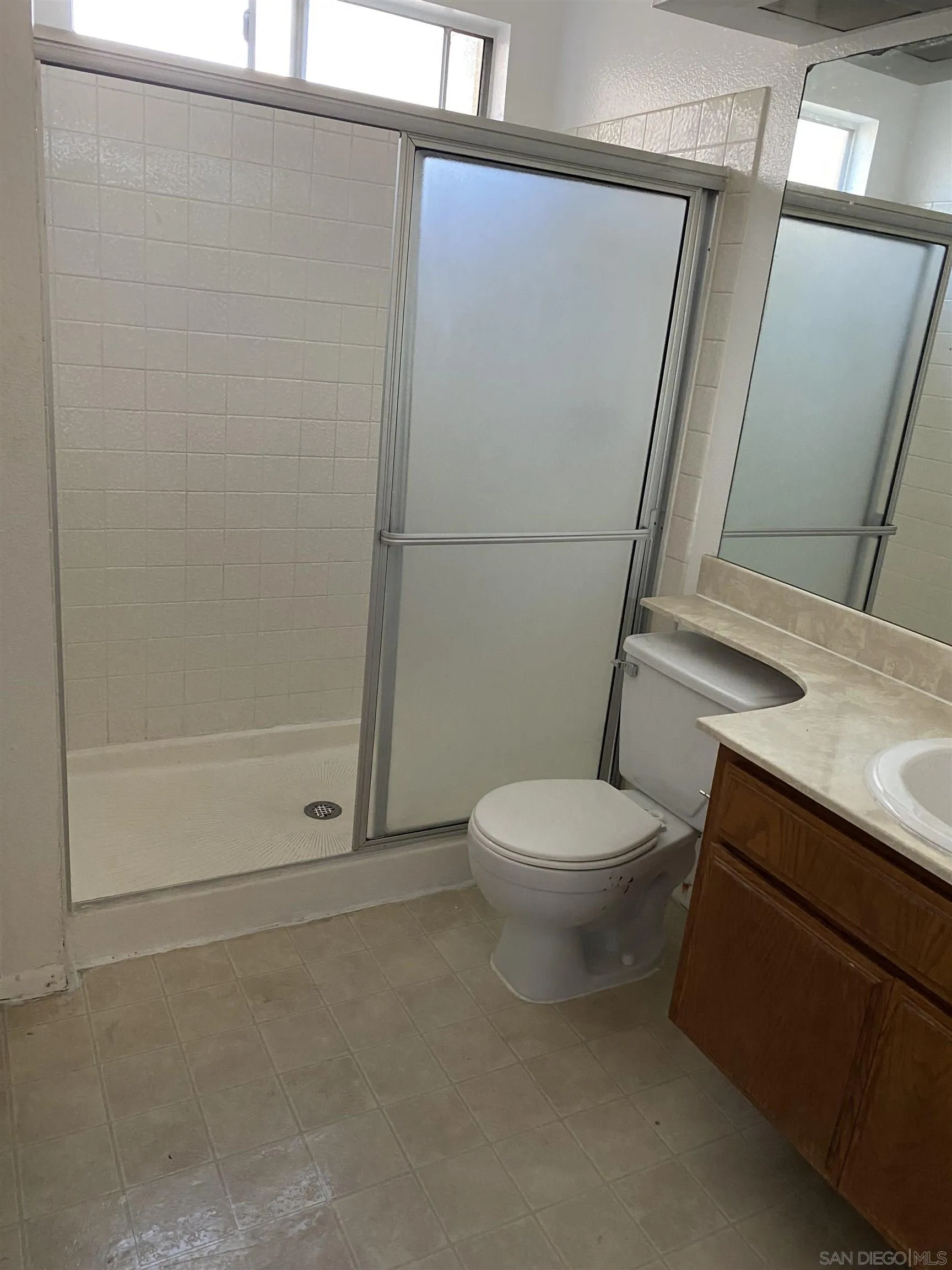 514 Jamacha Road, Unit 24J El Cajon, CA 92019 - Photo 25 of 32 a white toilet sitting next to a bathroom sink