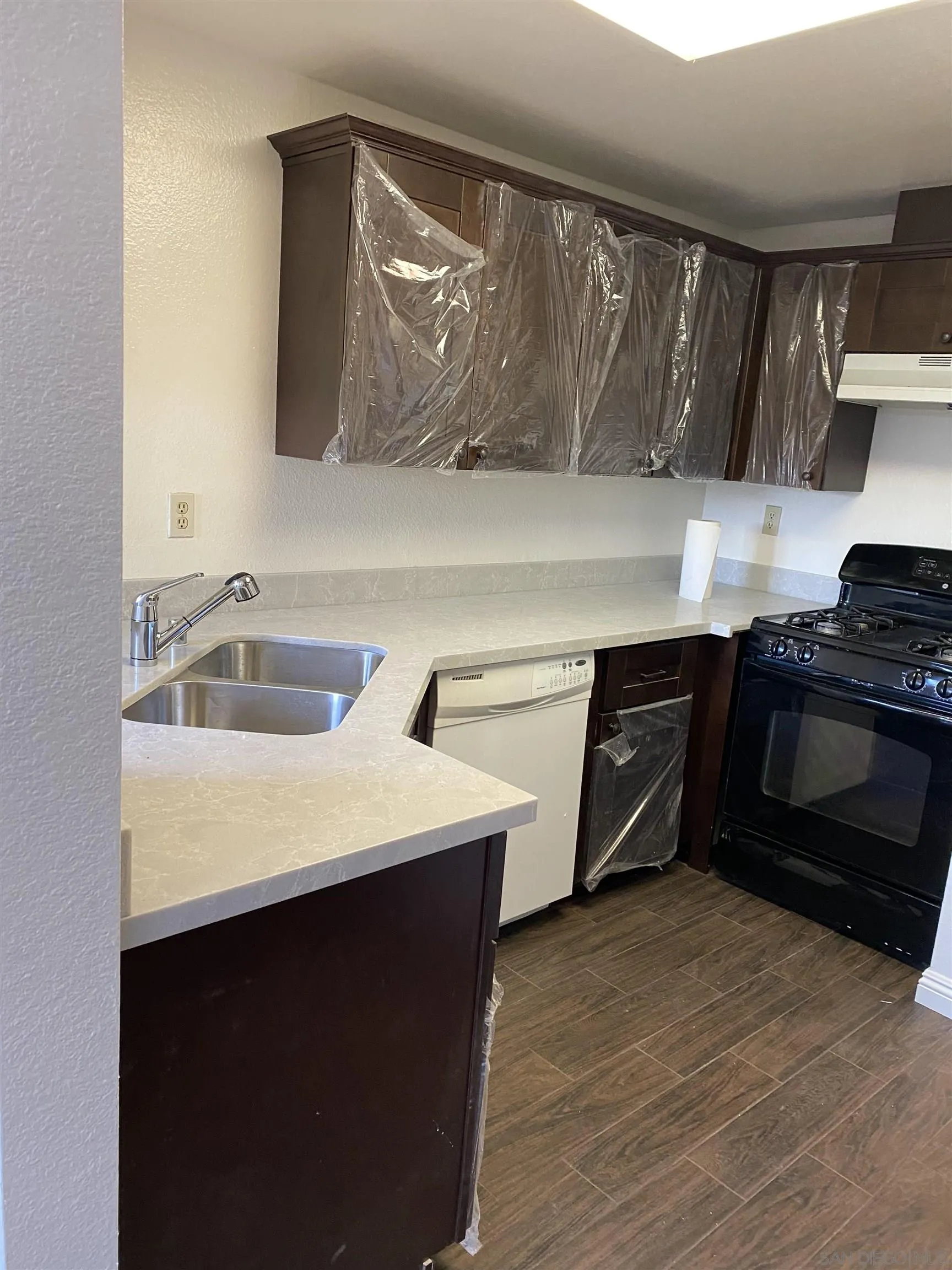 514 Jamacha Road, Unit 24J El Cajon, CA 92019 - Photo 8 of 32 a kitchen with a sink cabinets and stainless steel appliances