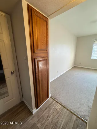 an empty room with wooden floor