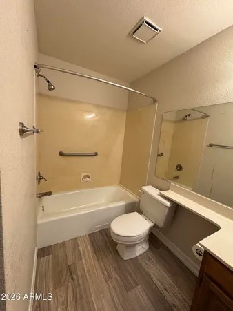 a bathroom with a sink a toilet and a bathtub
