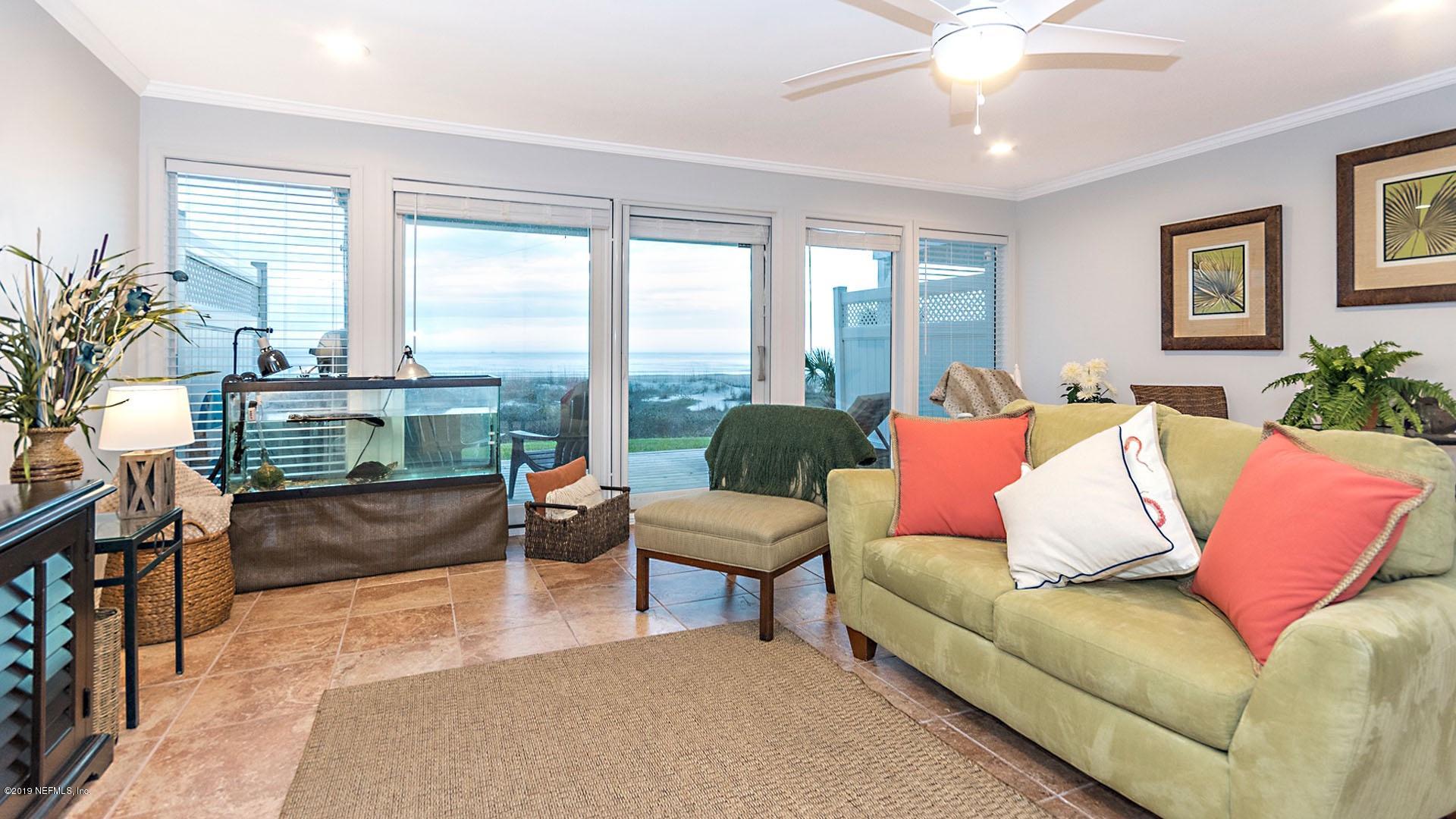 2233 Seminole Road, Unit 15 Atlantic Beach, FL 32233 - Photo 12 of 48 a living room with furniture and a large window