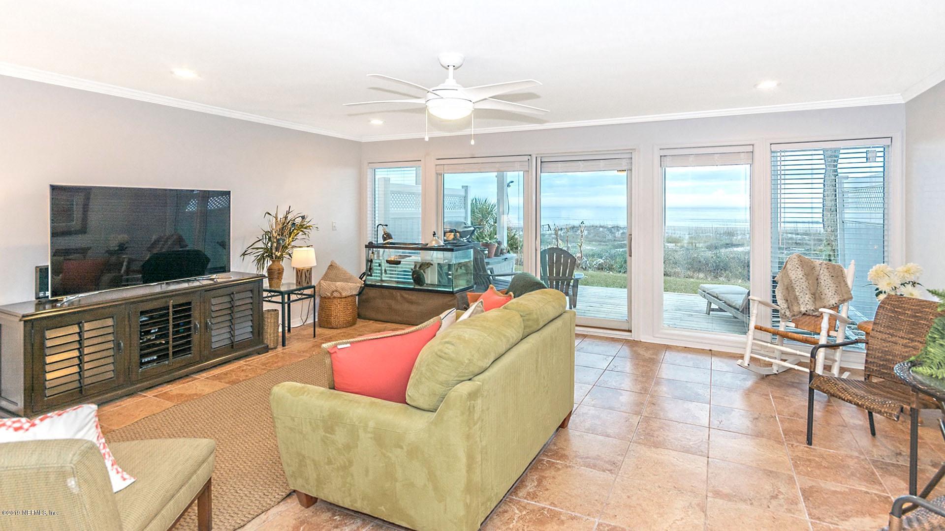 2233 Seminole Road, Unit 15 Atlantic Beach, FL 32233 - Photo 48 of 48 a living room with furniture and a flat screen tv