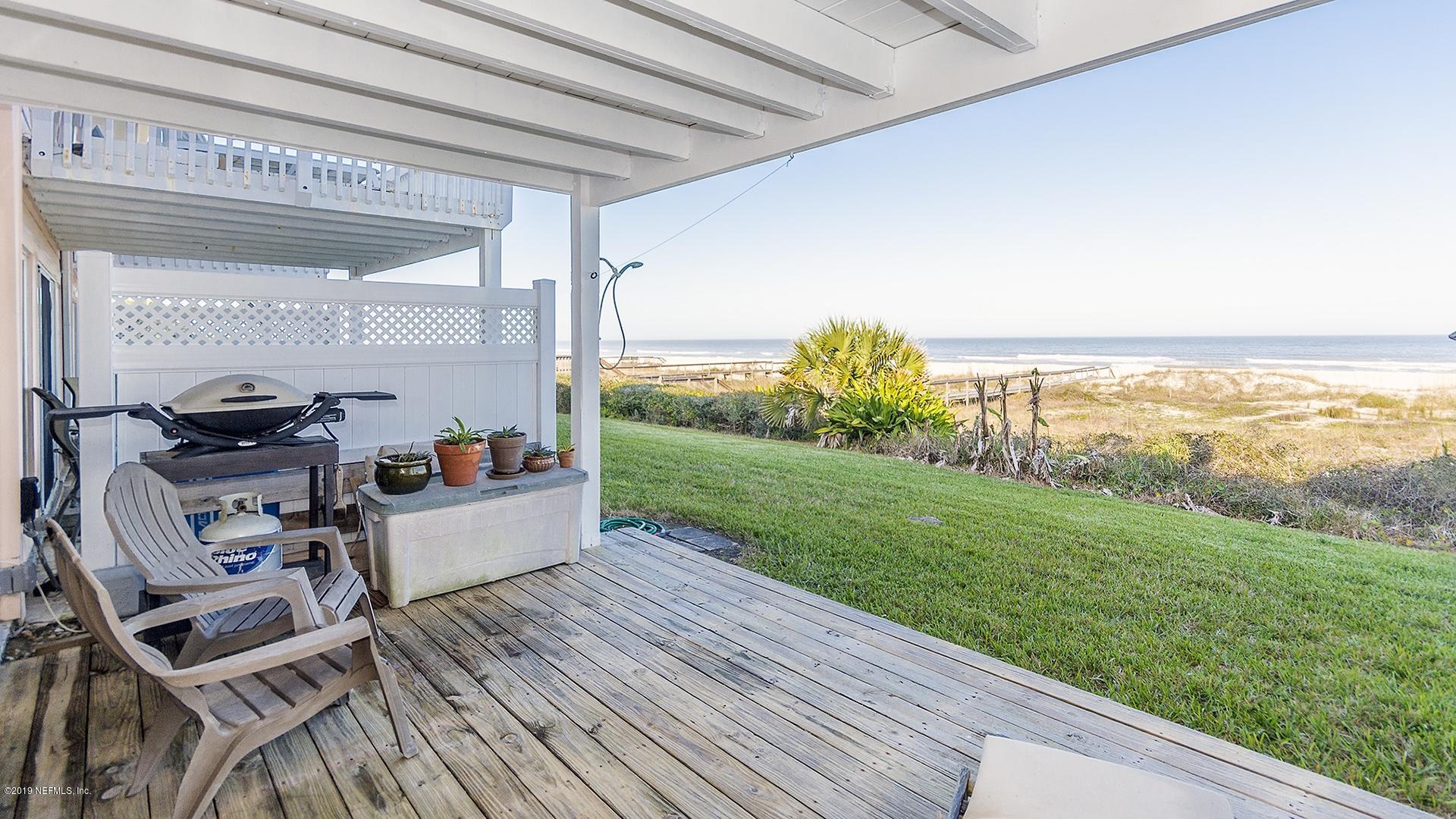 2233 Seminole Road, Unit 15 Atlantic Beach, FL 32233 - Photo 2 of 48 a view of a chairs and table in patio with a yard