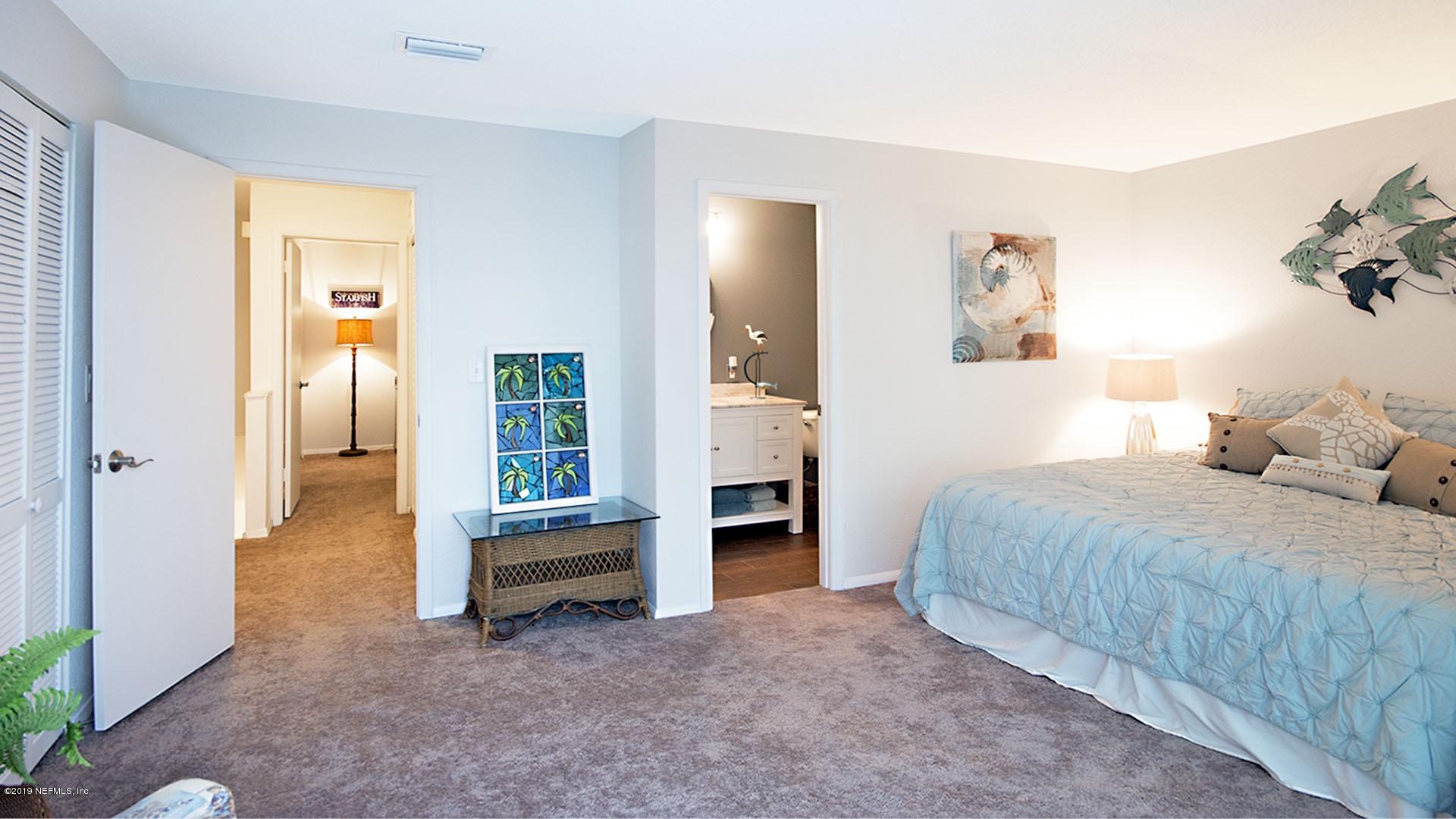 2233 Seminole Road, Unit 15 Atlantic Beach, FL 32233 - Photo 21 of 48 a bedroom with a bed and a television