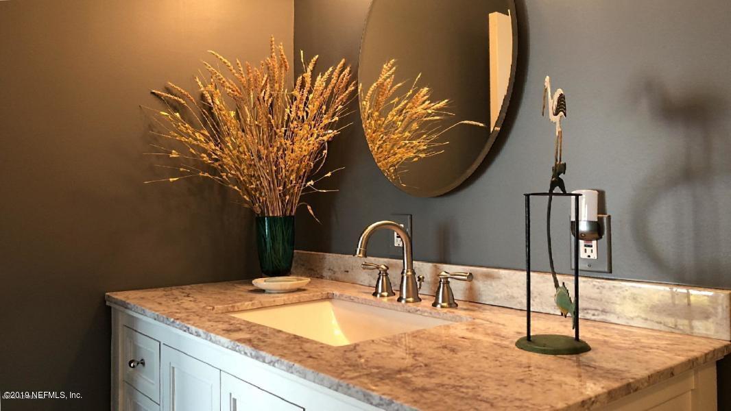 2233 Seminole Road, Unit 15 Atlantic Beach, FL 32233 - Photo 23 of 48 a bathroom with a sink and a mirror