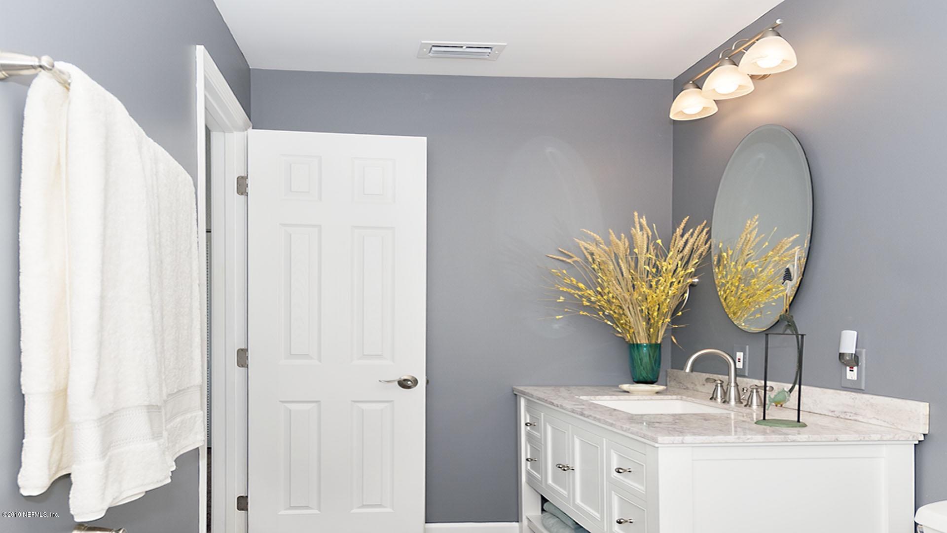 2233 Seminole Road, Unit 15 Atlantic Beach, FL 32233 - Photo 24 of 48 a bathroom with a sink and a mirror