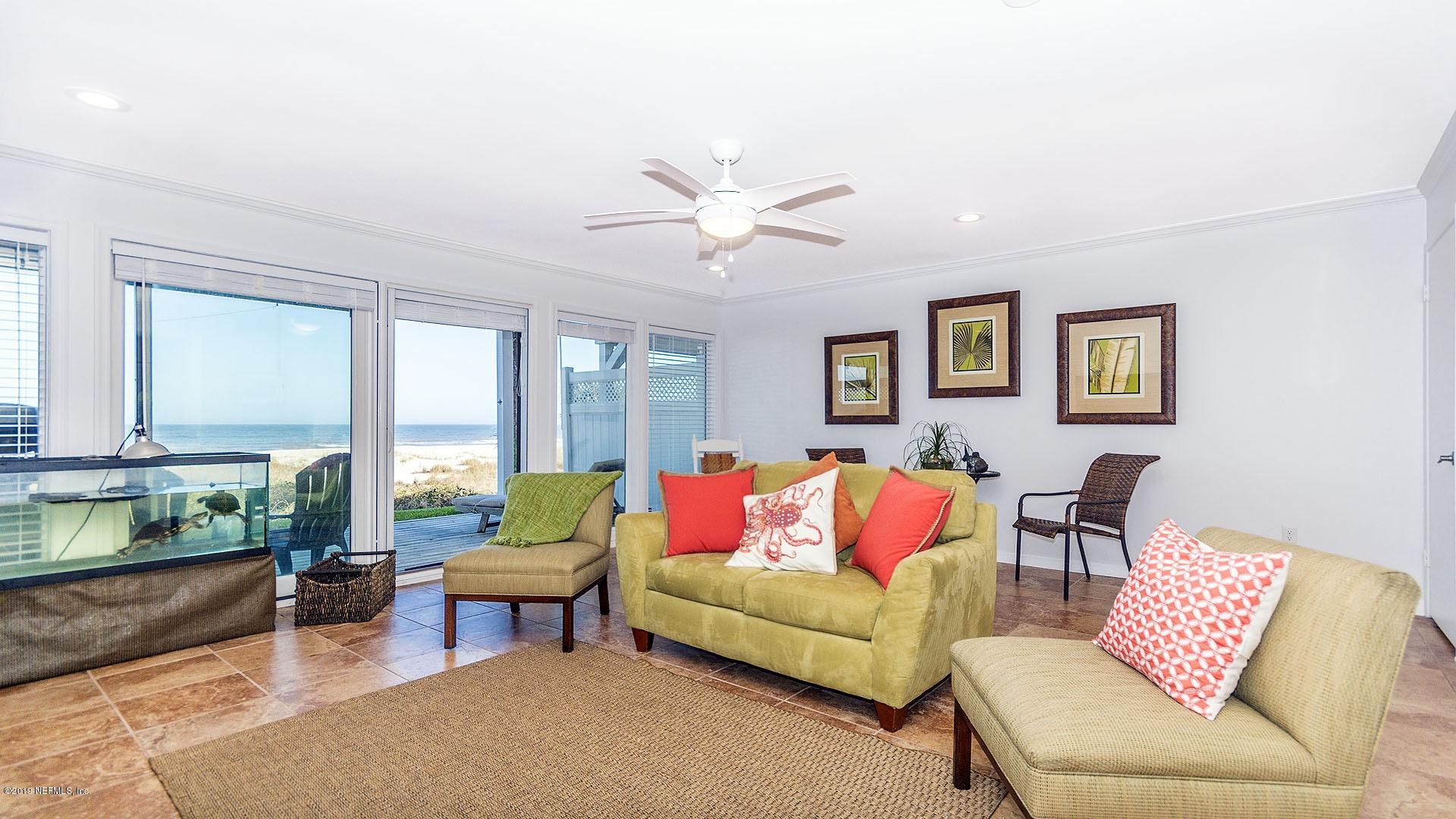 2233 Seminole Road, Unit 15 Atlantic Beach, FL 32233 - Photo 9 of 48 a living room with furniture and a large window
