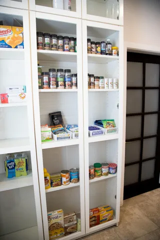 a aerial view of a house with a yard table and chairs
