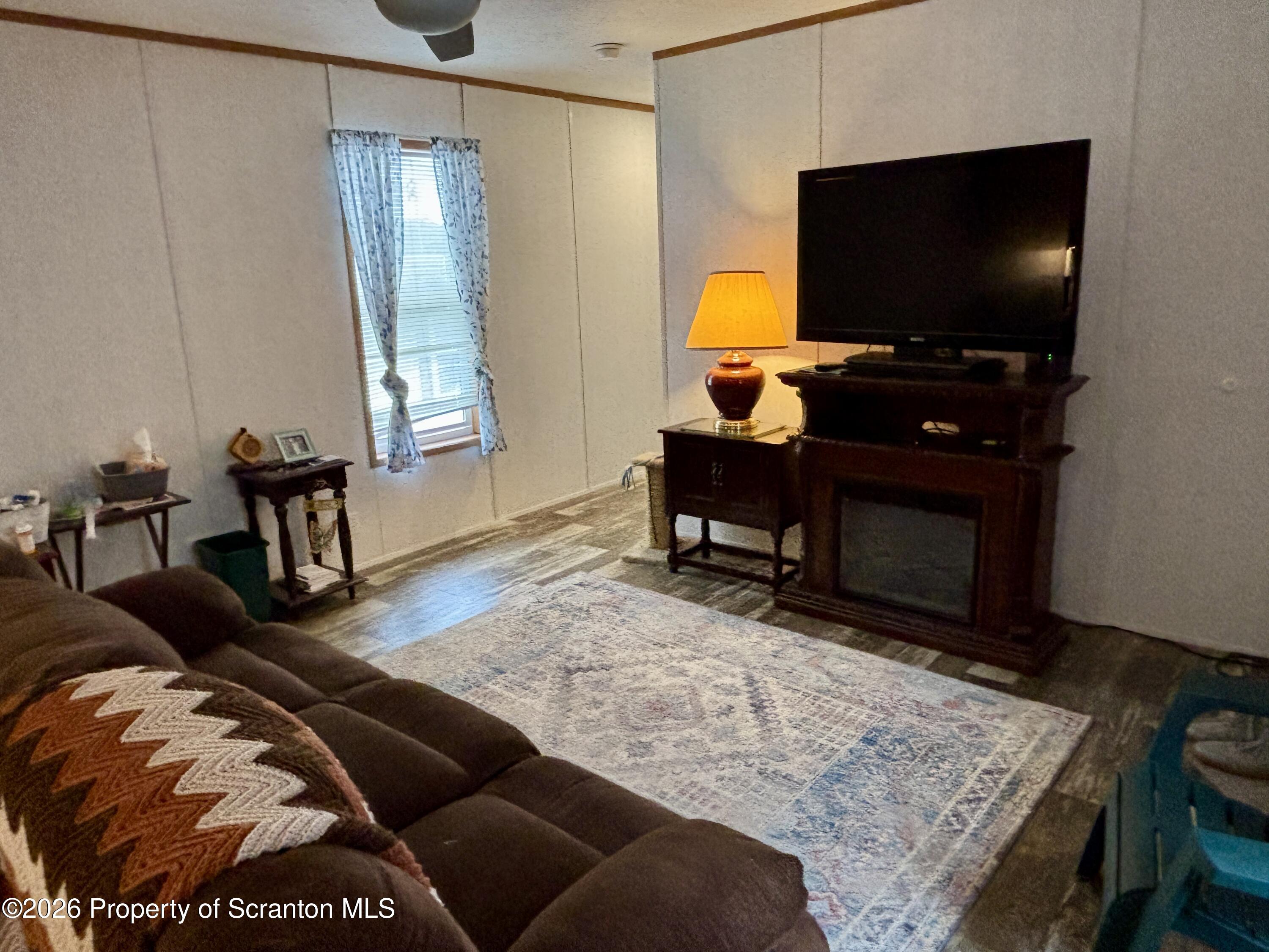 62 Timber Trail Factoryville, PA 18419 - Photo 17 of 23 a living room with furniture and a flat screen tv