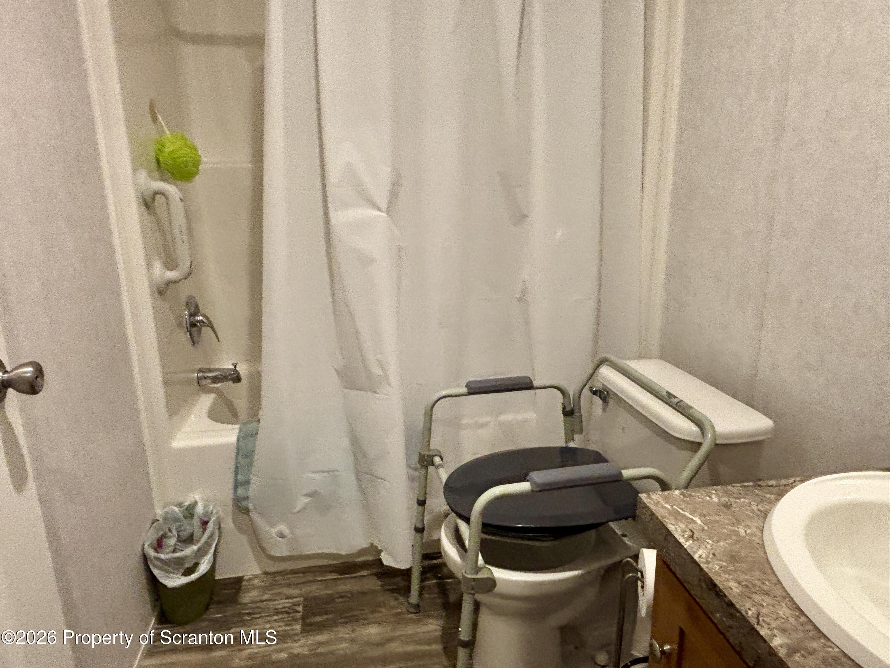62 Timber Trail Factoryville, PA 18419 - Photo 23 of 23 a bathroom with a granite countertop toilet and a sink