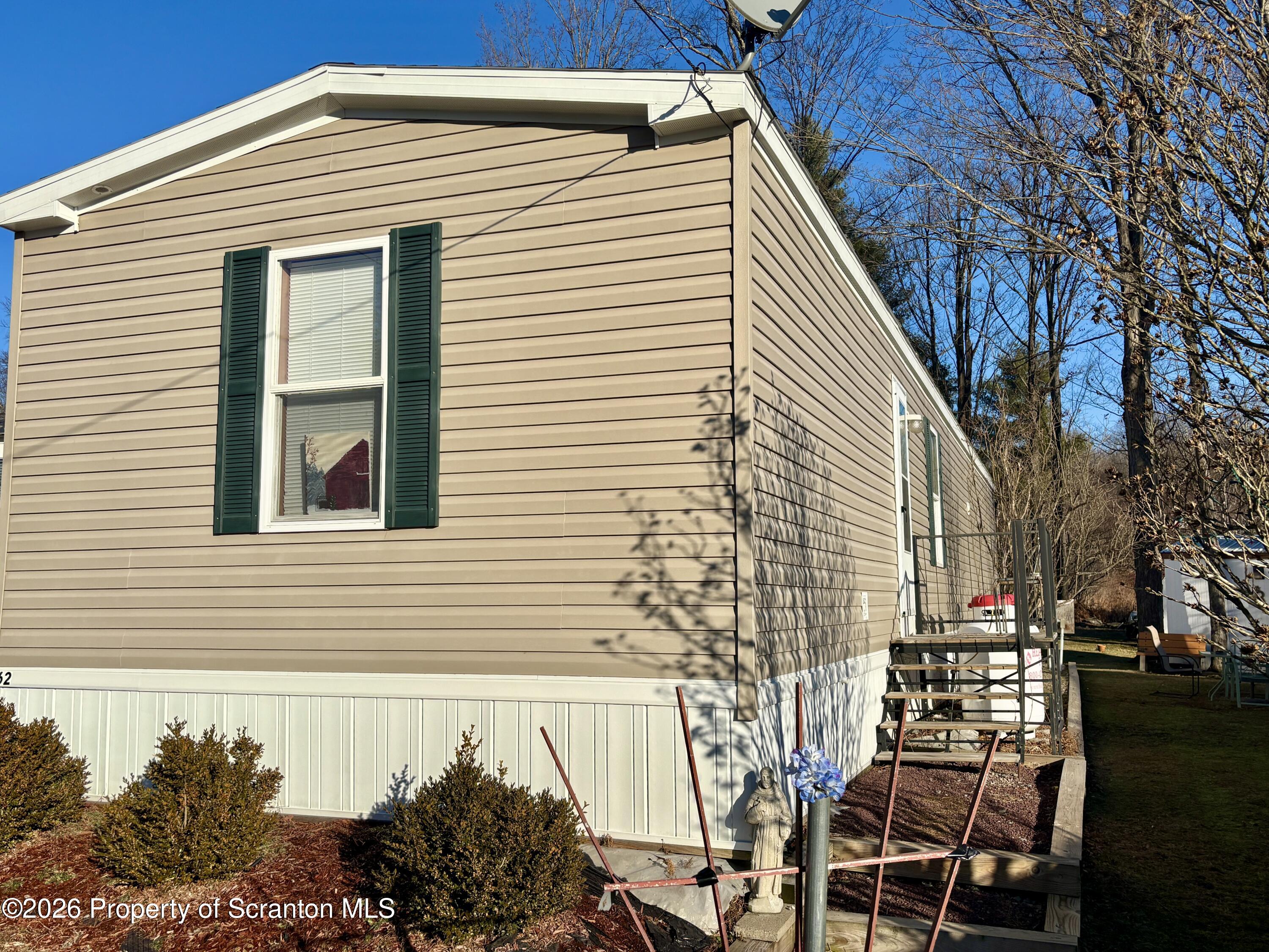 62 Timber Trail Factoryville, PA 18419 - Photo 3 of 23 a view of a house with a yard and sitting area