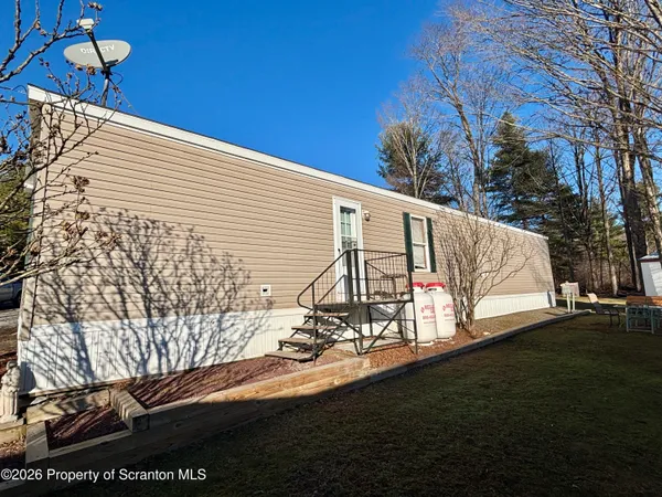 a view of a balcony with yard