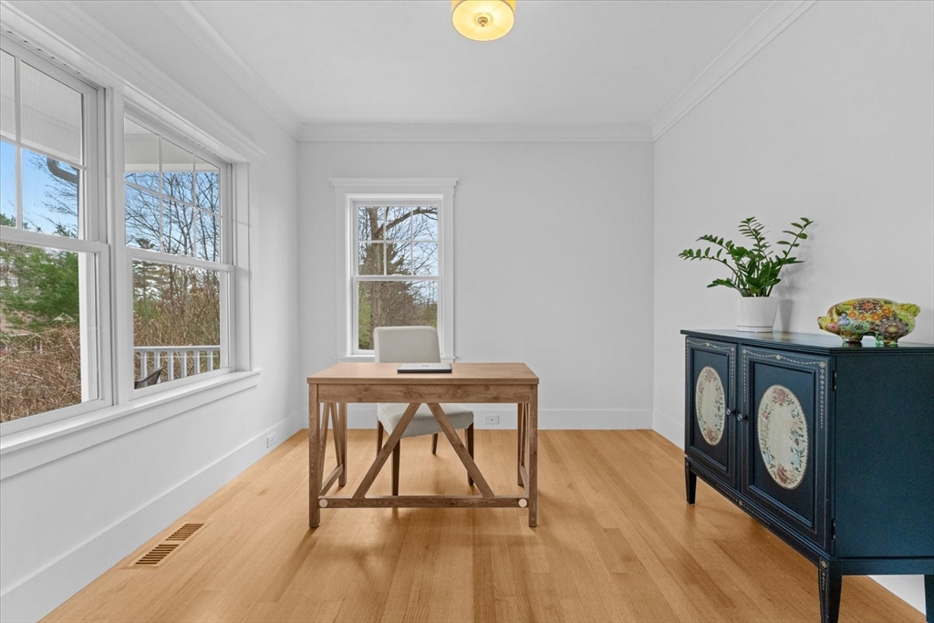 50 Quabbin Path Sutton, MA 01590 - Photo 10 of 42 a view of a workspace with furniture and a potted plant