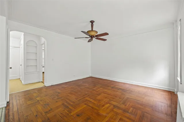 a view of a room with a ceiling fan