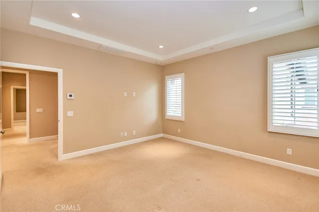 a bathroom with a granite countertop sink mirror and a bathtub