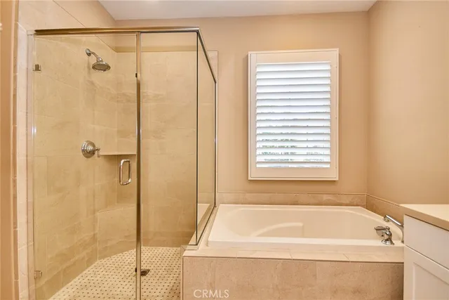 a bathroom with a tub and shower