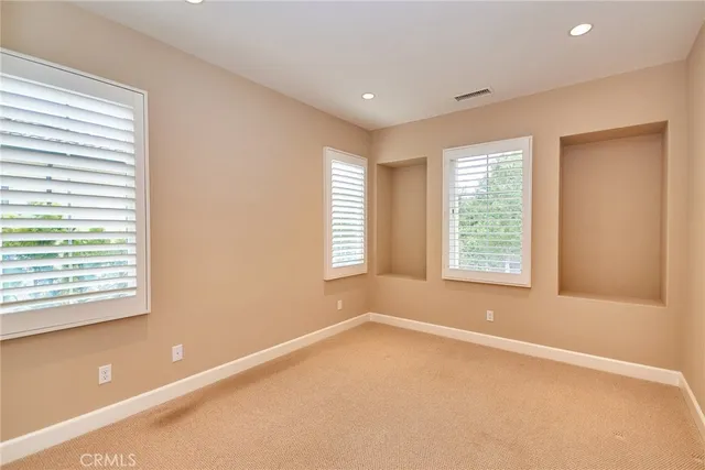 a bathroom with a double vanity sink mirror and shower