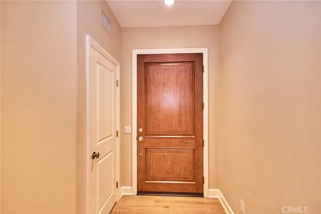 a view of a hallway with front door