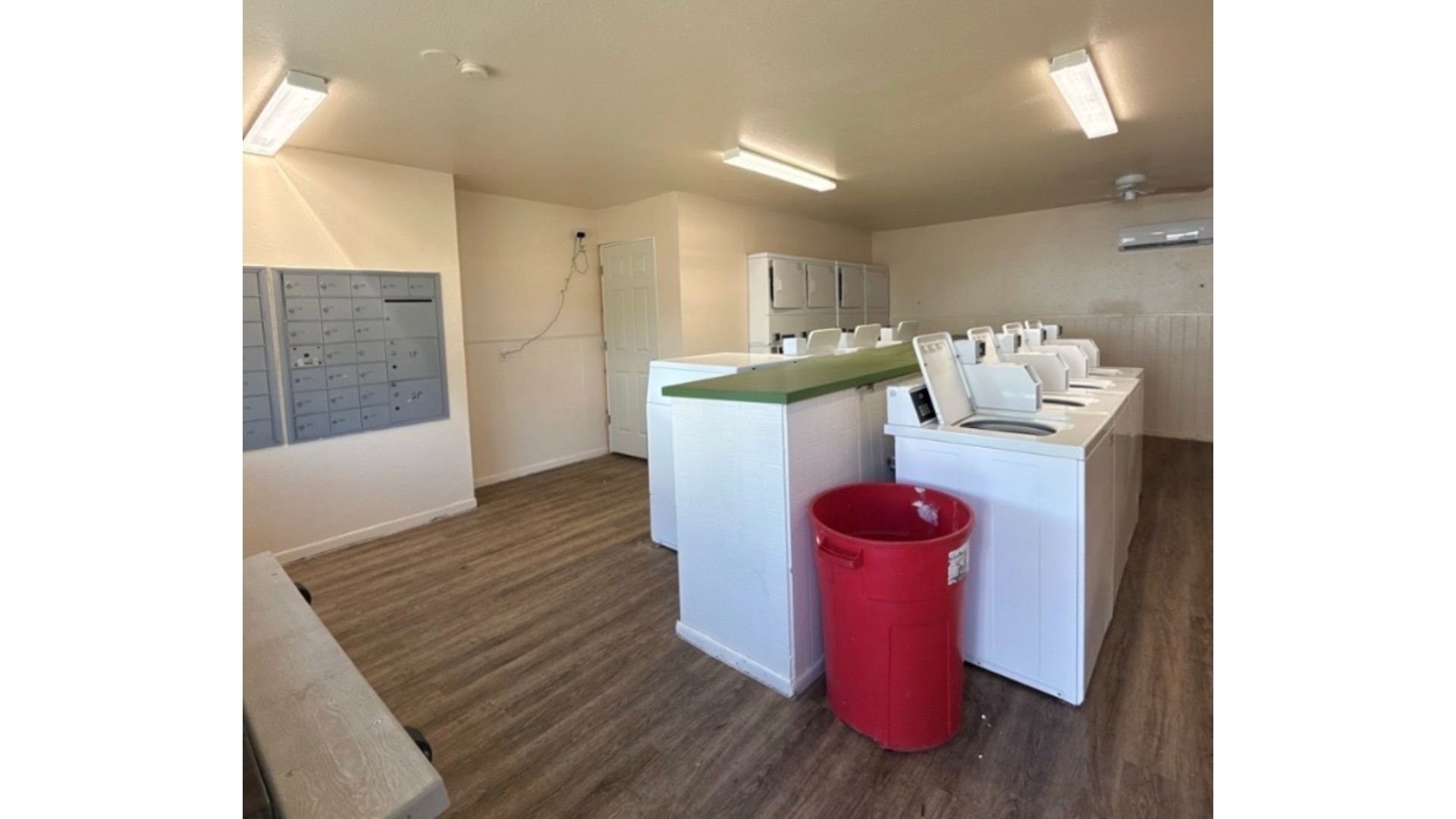 516 Laredo Street Navasota, TX 77868 - Photo 9 of 13 a kitchen with a refrigerator and a wooden floor