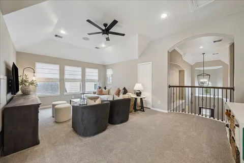 a view of living room with furniture and flat screen tv