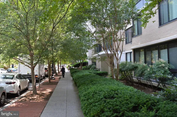 a view of a pathway with a house in the background