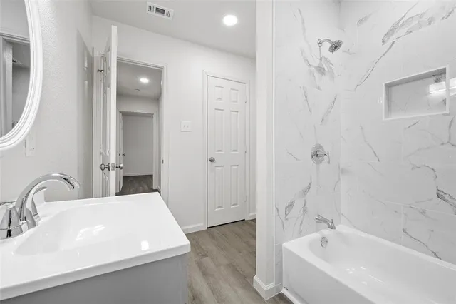 a bathroom with a sink and a tub