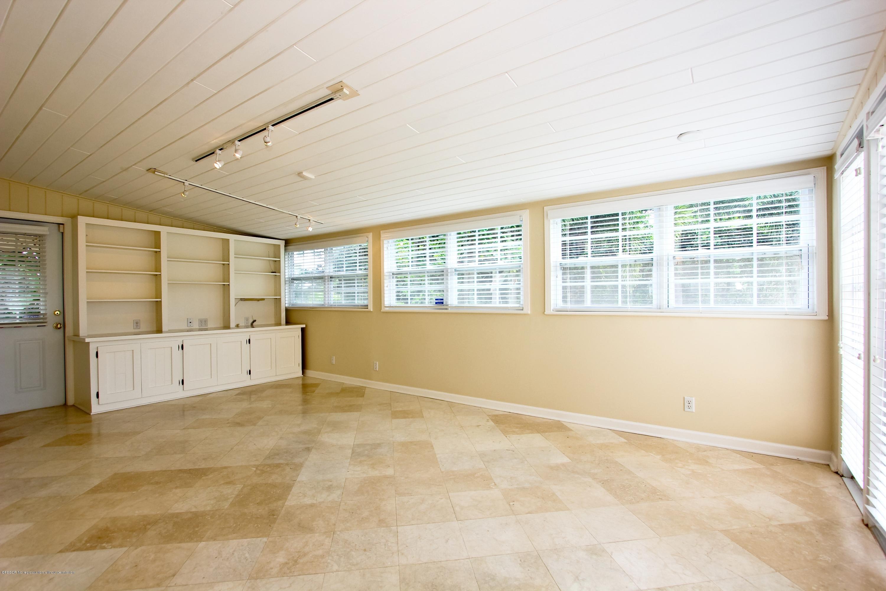 7312 Washington Road West Palm Beach, FL 33405 - Photo 4 of 10 an empty room with large windows