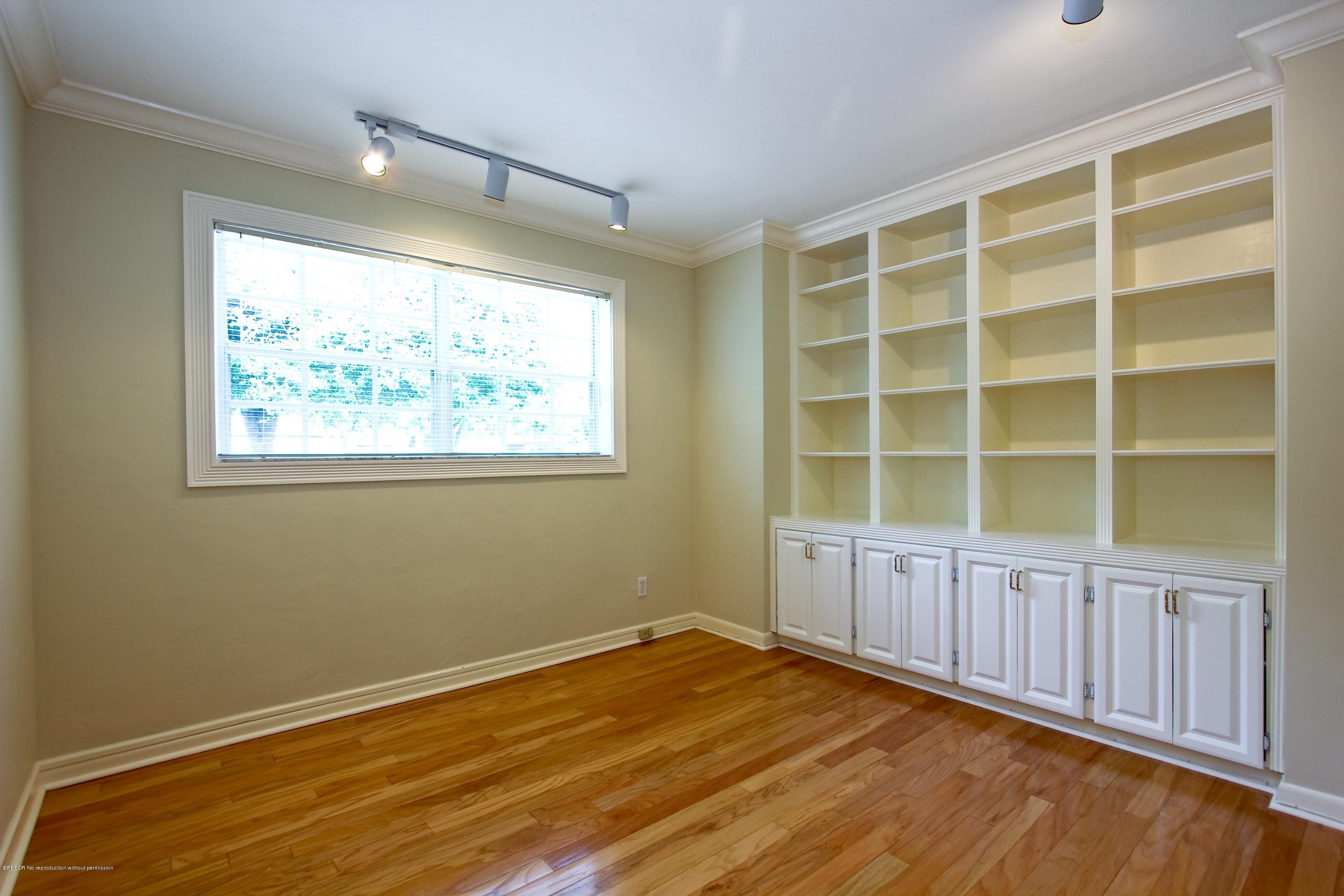 7312 Washington Road West Palm Beach, FL 33405 - Photo 8 of 10 a view of an empty room with a window and wooden floor