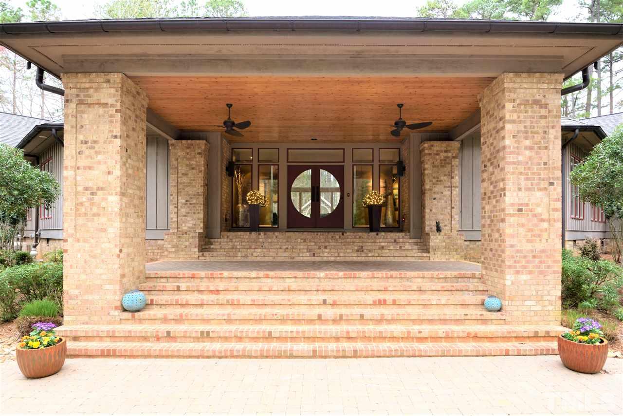 5217 Ginger Trail Raleigh, NC 27614 - Photo 2 of 30 Driveway pavers reflect the motif of the front door