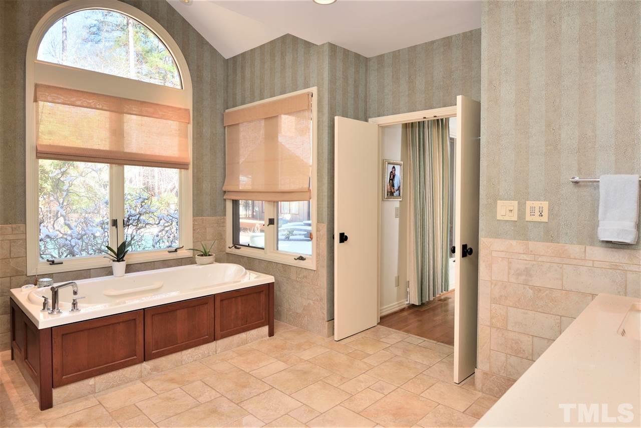5217 Ginger Trail Raleigh, NC 27614 - Photo 17 of 30 Master bath features a generous air-jet whirlpool and massive open shower with seat and rain forest shower head