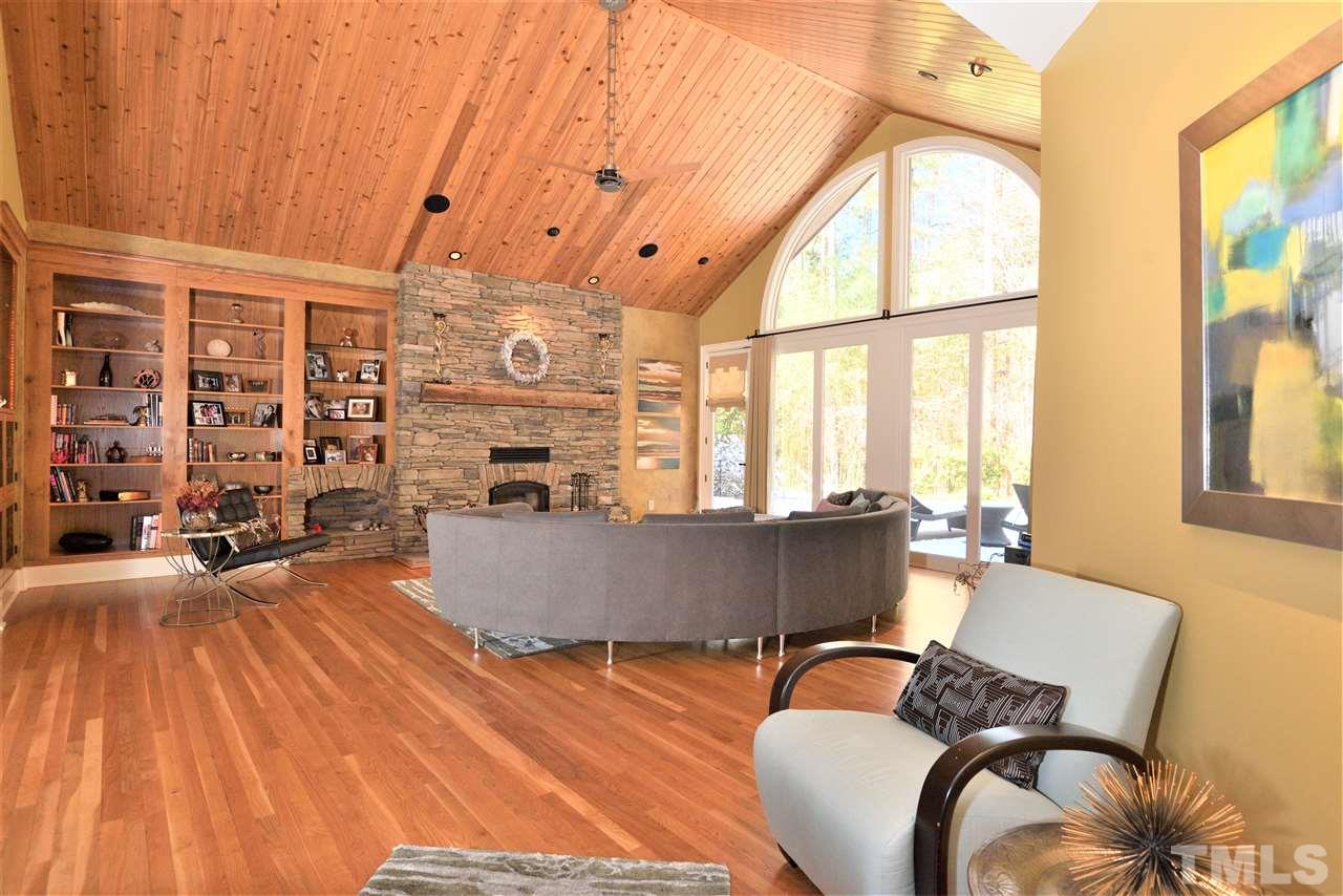 5217 Ginger Trail Raleigh, NC 27614 - Photo 22 of 30 Stone front fireplace reaches towards the Michigan cedar cathedral ceiling