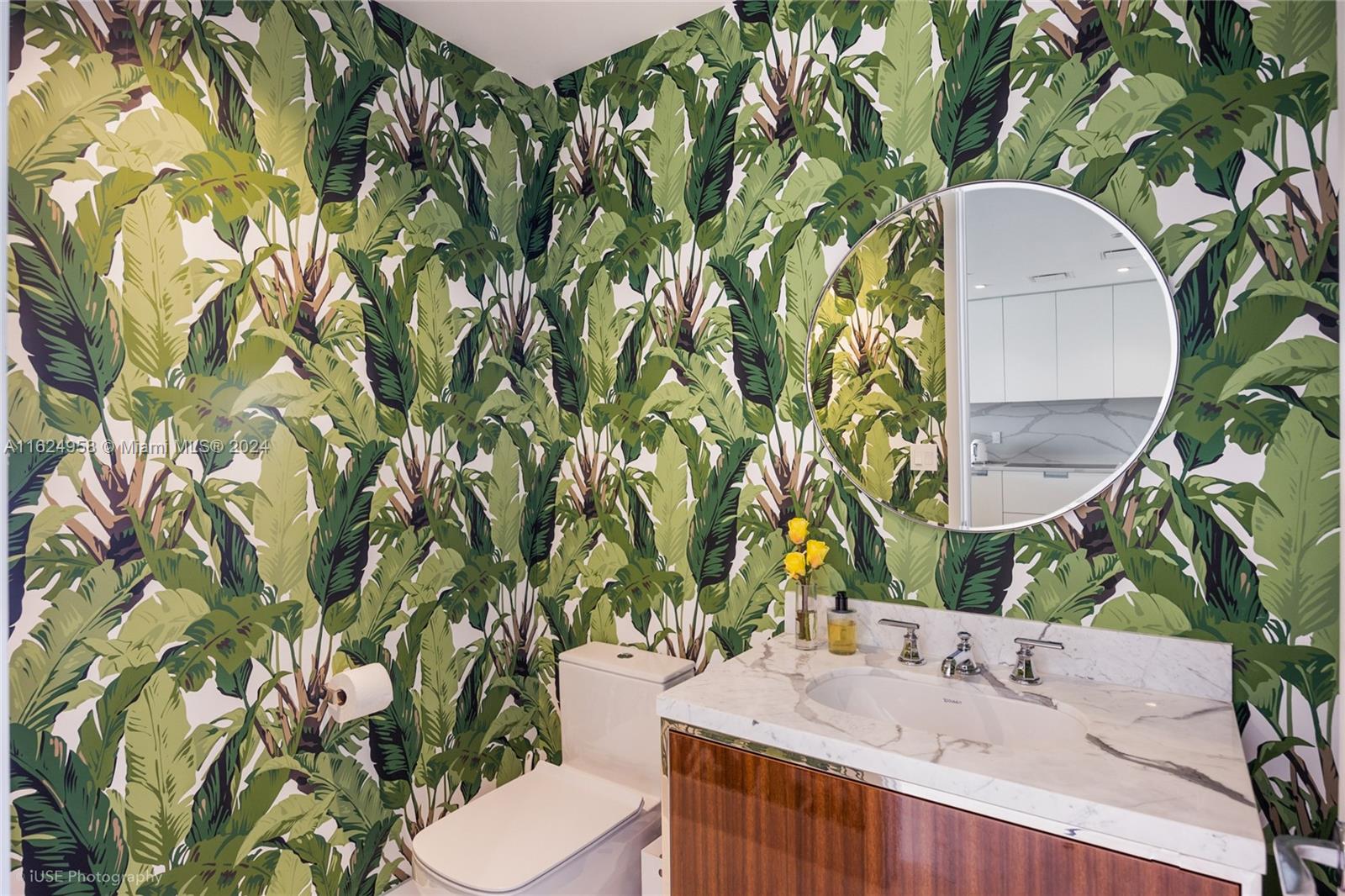 15701 Collins Avenue, Unit 4303 Sunny Isles Beach, FL 33160 - Photo 7 of 12 a bathroom with a sink and mirror