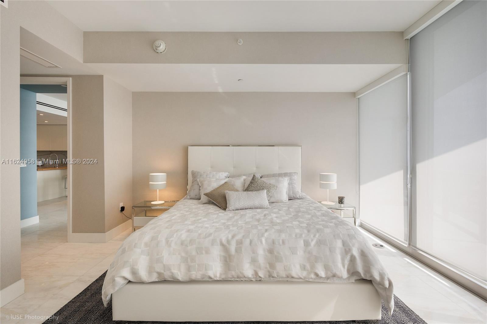 15701 Collins Avenue, Unit 4303 Sunny Isles Beach, FL 33160 - Photo 8 of 12 a large white bed in a white room