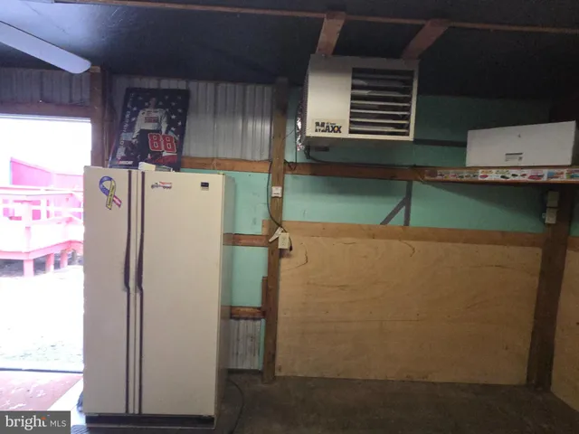 a view of storage and utility room with washer and dryer