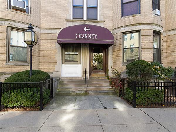 44 Orkney Road, Unit 5 Boston, MA 02135 - Photo 1 of 12 a front view of a brick house with a small garden
