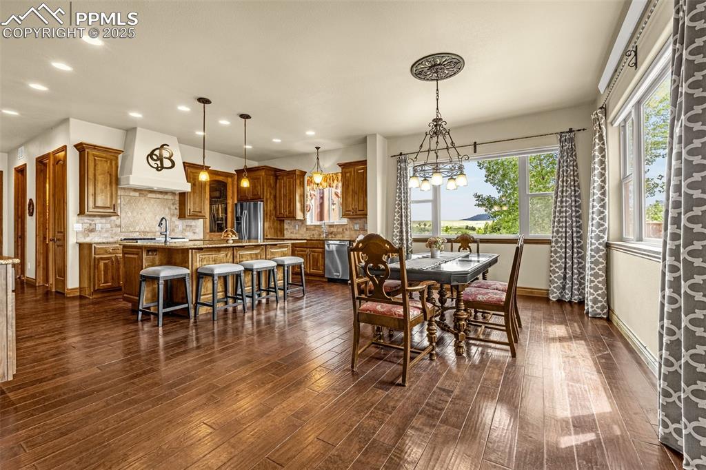 11784 Spruce Mountain Road Larkspur, CO 80118 - Photo 12 of 49 a view of a dining room with furniture window and outside view