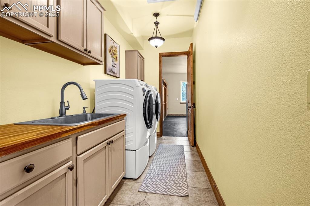 11784 Spruce Mountain Road Larkspur, CO 80118 - Photo 19 of 49 a view of a hallway with a washer and dryer