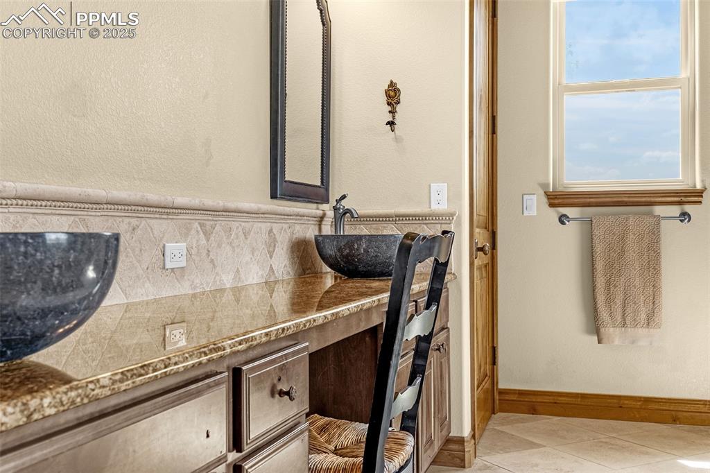 11784 Spruce Mountain Road Larkspur, CO 80118 - Photo 25 of 49 a close view of sink and mirror